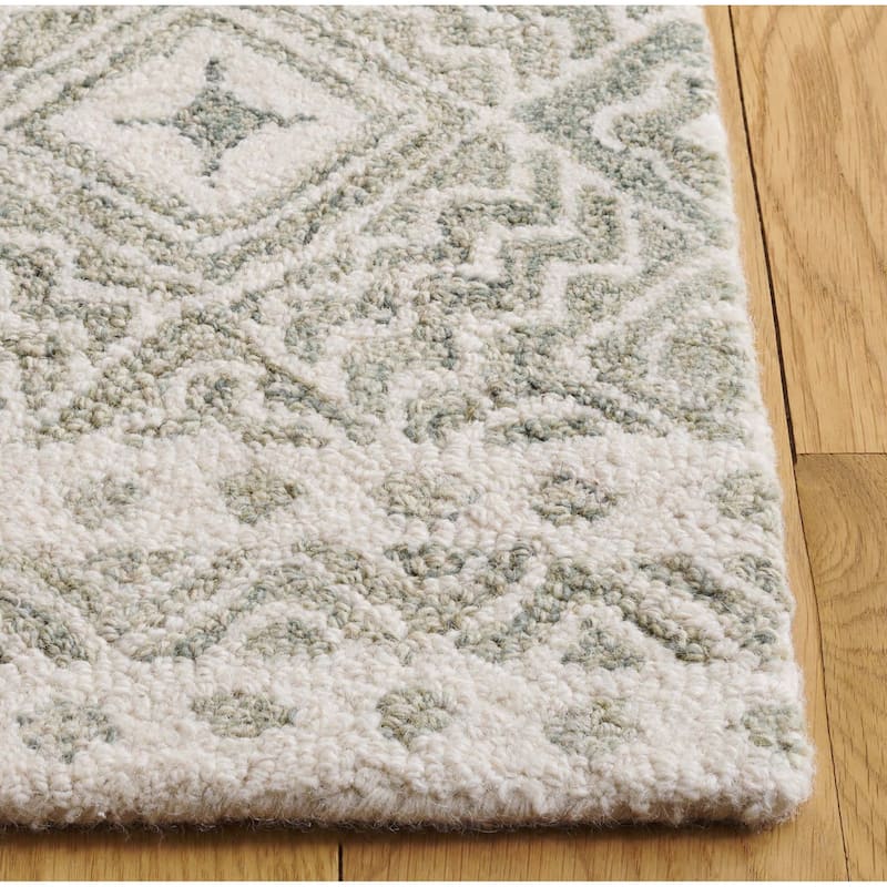 SAFAVIEH Handmade Micro-Loop Jelske Wool Rug
