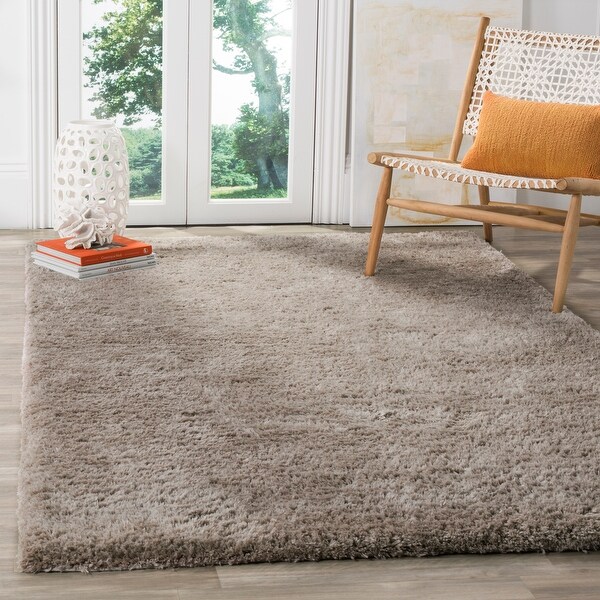 Safavieh Handmade Sheep Shag Emmeline Solid Polyester Rug. Opens flyout.