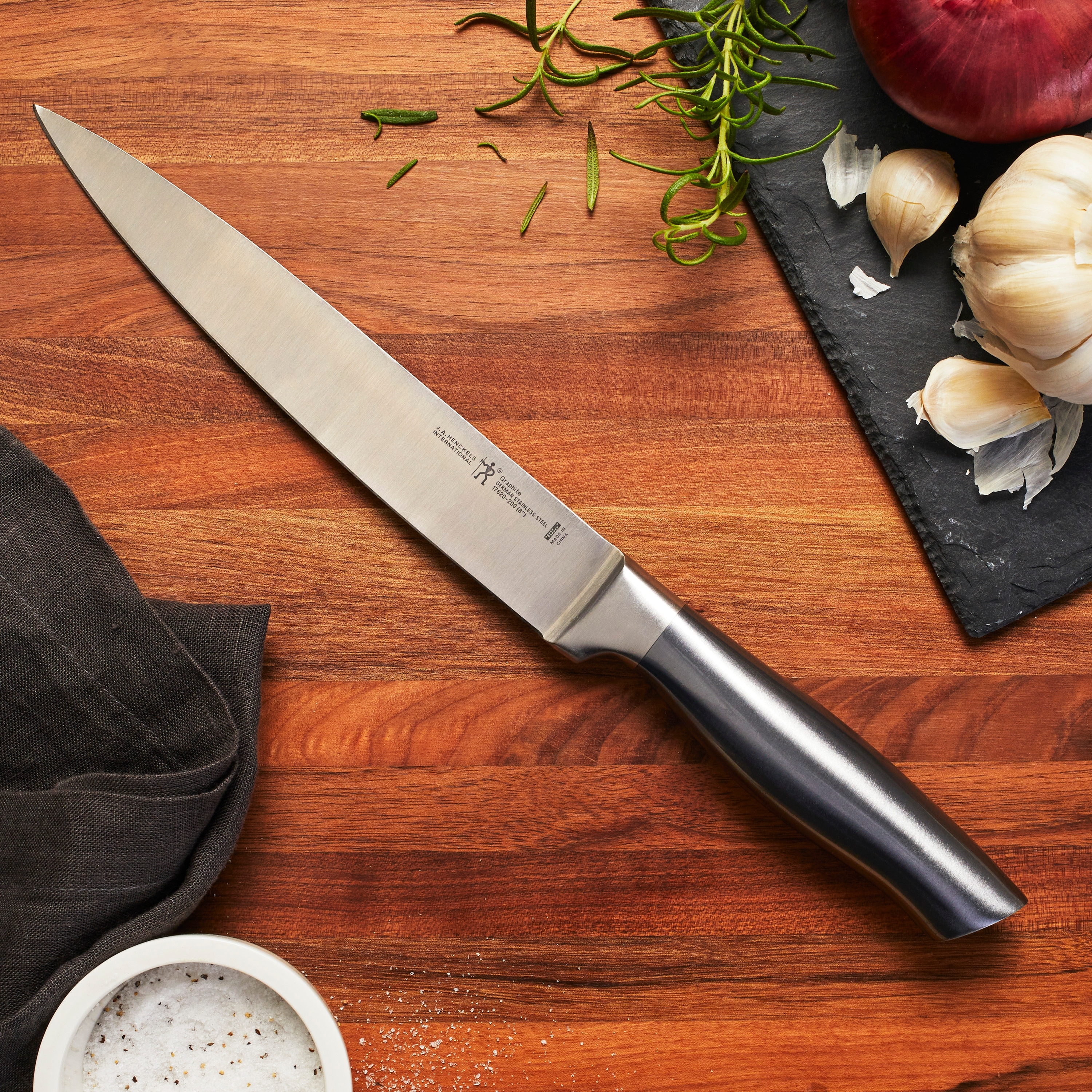 https://ak1.ostkcdn.com/images/products/is/images/direct/bc905e236b9015d13b29bfe981be03cb8d1986fb/Henckels-Graphite-8-inch-Carving-Knife.jpg