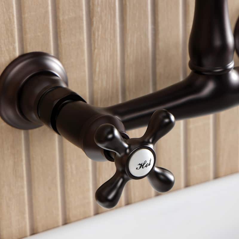 Kingston Brass English Country Two-Handle 2-Hole Wall Mount Bathroom Faucet