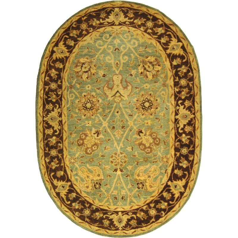 SAFAVIEH Handmade Antiquity Zuriñe Traditional Oriental Wool Rug - 4'6" x 6'6" Oval - Green/Brown