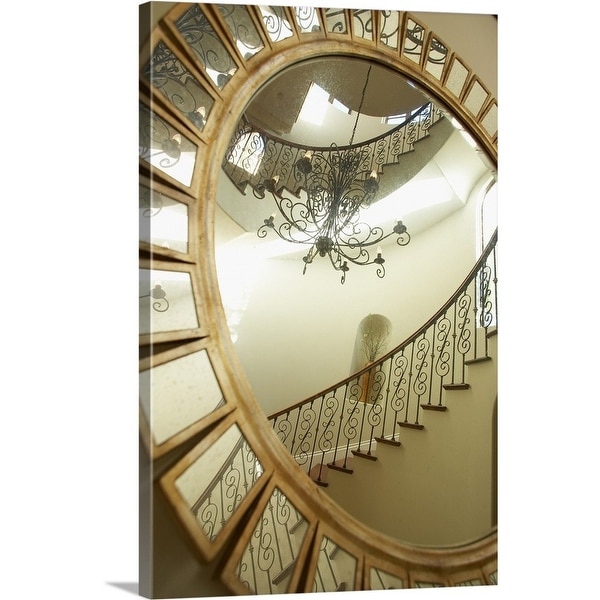 "Reflection of a chandelier and stairs in the mirror" Canvas Wall Art