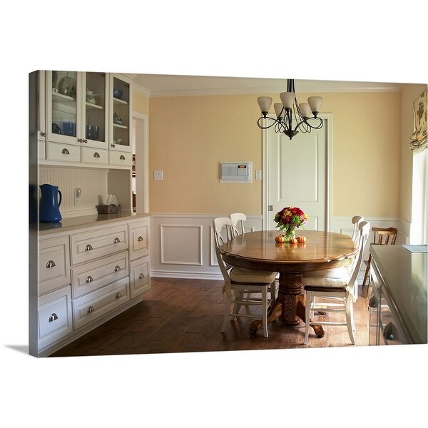 Shop "A kitchen with white cabinets and a table near the ...