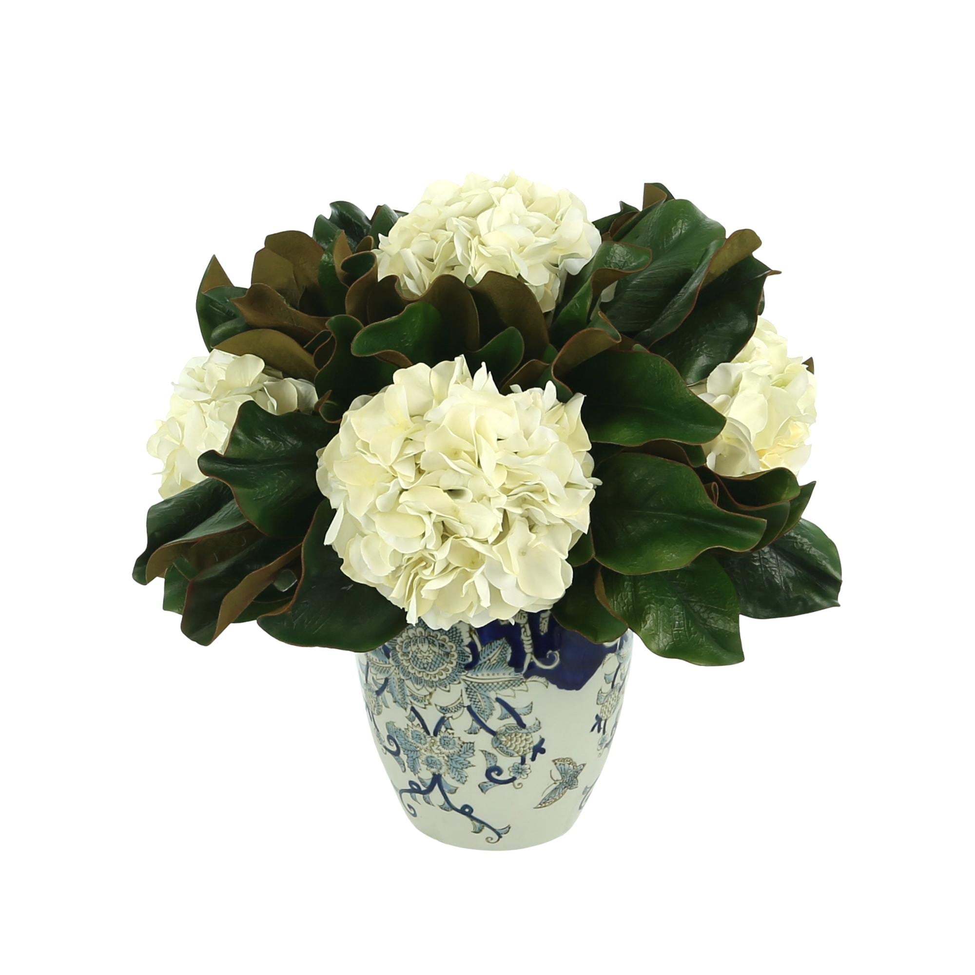 Hydrangea and Magnolia Leaf Arrangement in a Decorative Vase