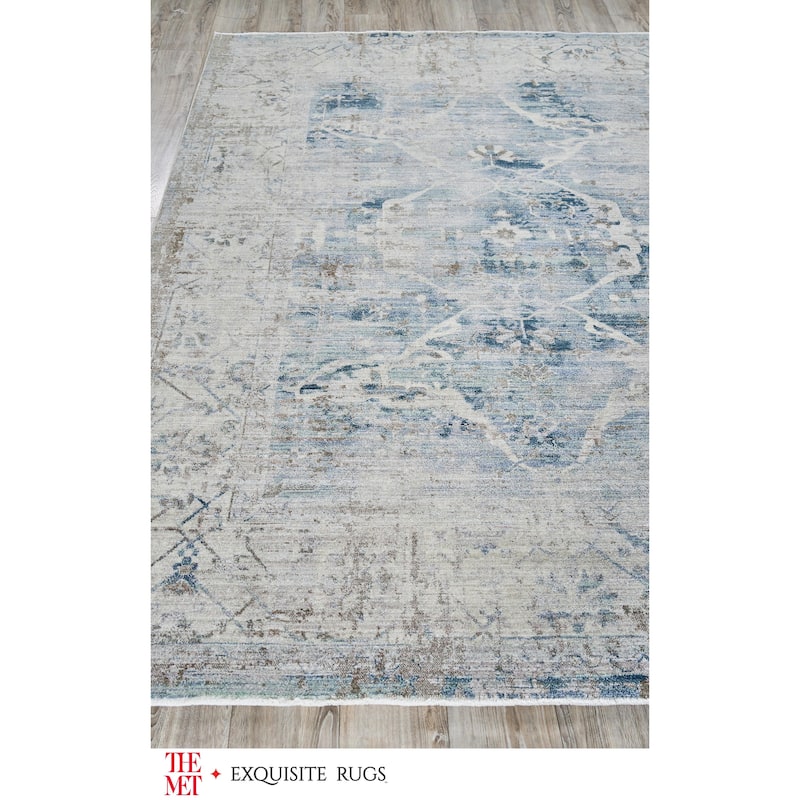 The Met X Exquisite Rugs Vintage Looms Light Blue/Beige Area Rug.