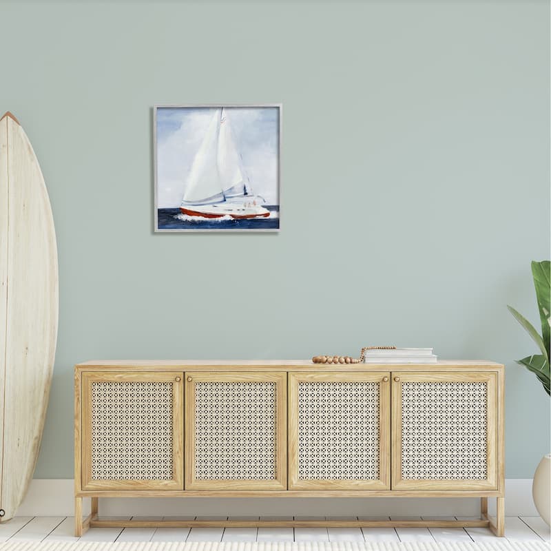 Stupell Sail Boat Against Cloudy Sky Ocean Foam Splashing Framed Wall Art - Blue