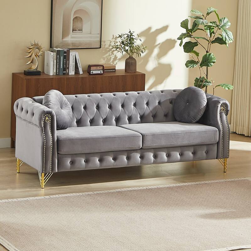 Chesterfield Sofa with Two Round Pillows, Featuring Copper Stud Detailing and Tufted Button Accents
