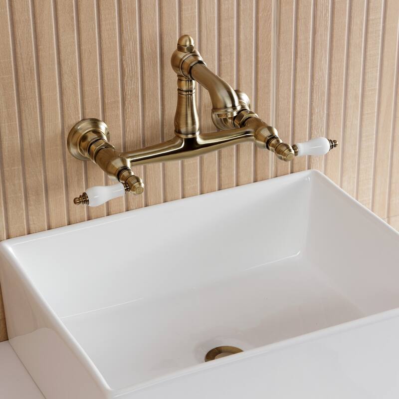 Kingston Brass English Country Two-Handle 2-Hole Wall Mount Bathroom Faucet
