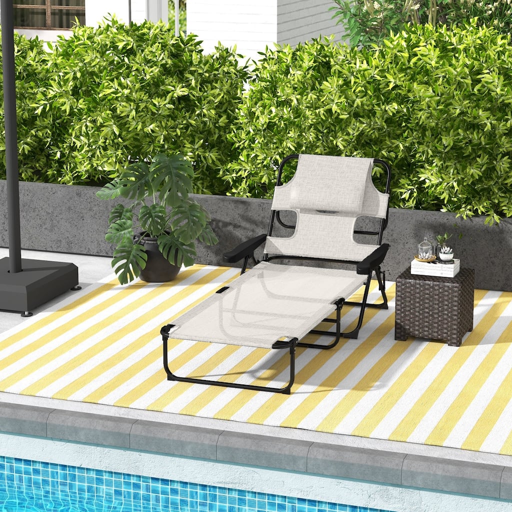 Folding sun loungers with face holes, arm slots and pillows