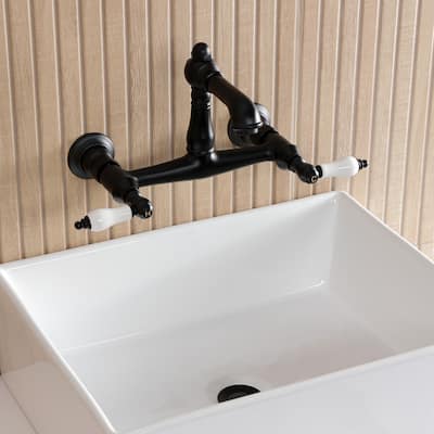 Kingston Brass English Country Two-Handle 2-Hole Wall Mount Bathroom Faucet
