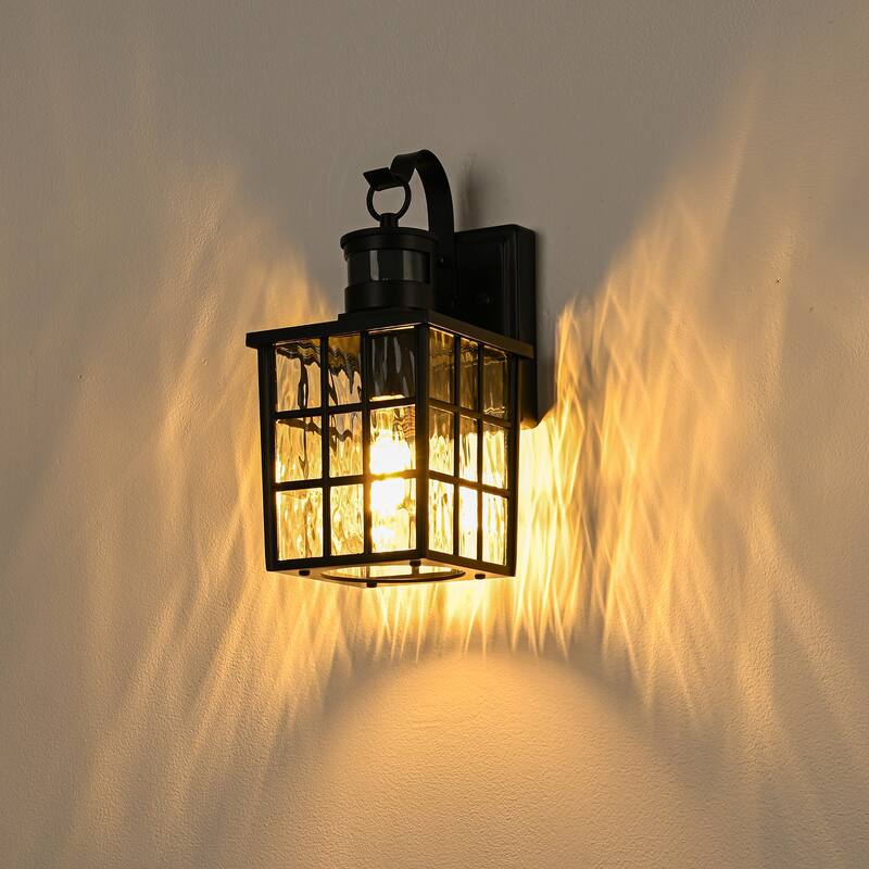 12 in. Matte Black 1-Light Motion Sensing Outdoor Wall Sconce with Dusk to Dawn and Water Wave Glass Shade