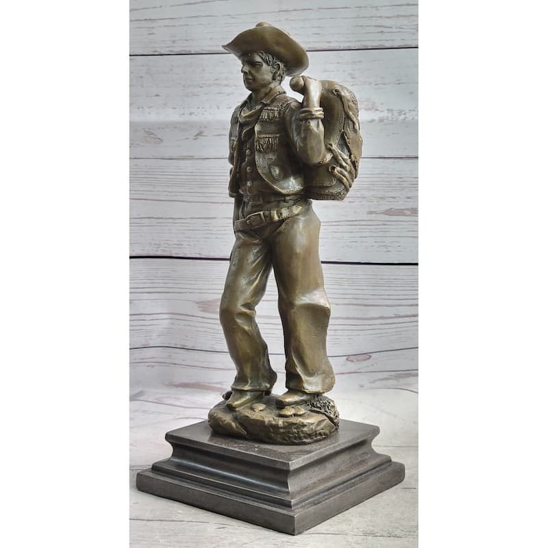 Country Western Cowboy In Chaps Carrying Imitative Horse Saddle Bronze Statue Sculpture Figure 12 Inches X 4 Inches