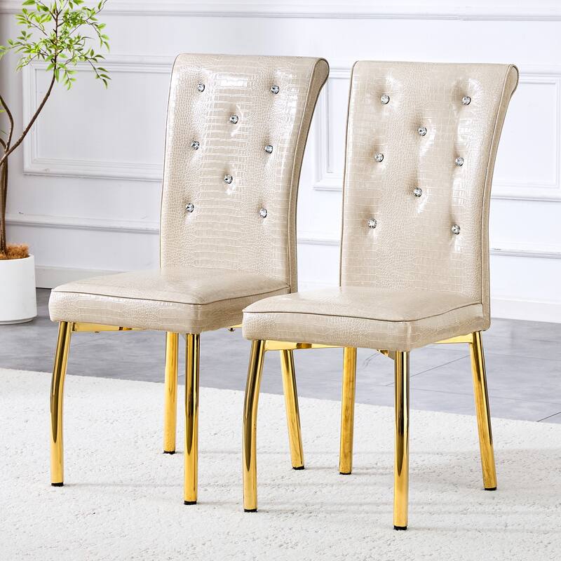 A set of 2 vintage crocodile leather cushioned dining chairs, featuring crystal clasp design and artificial leather design