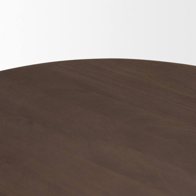 The Shima Coffee Table is a smooth, dark matte brown oval coffee table with curved edges and arched cut out legs.
