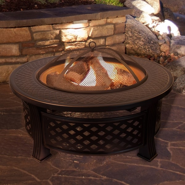 https://ak1.ostkcdn.com/images/products/is/images/direct/c013e2ae7915fc0b25cf3cc03901e43b3e477ac9/Nature-Spring-32%22-Round-Fire-Pit--Steel-Patio-Ring.jpg?impolicy=medium