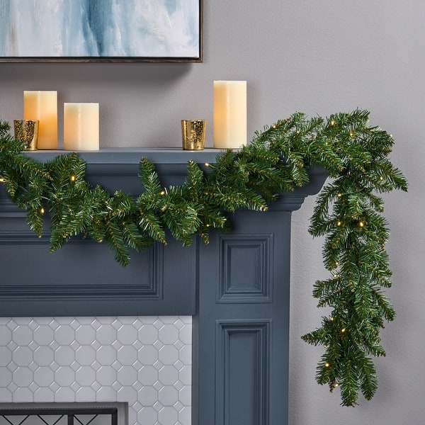slide 2 of 6, 9-foot Norway Spruce Pre-Lit Warm White LED Artificial Christmas Garland by Christopher Knight Home - led - clear led - clear