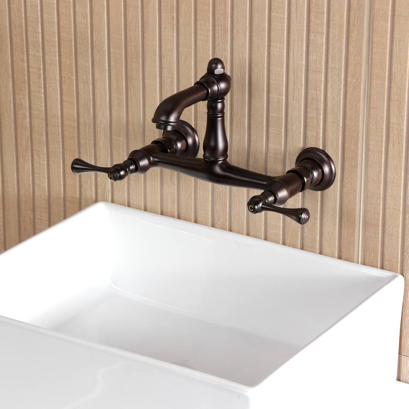 Kingston Brass English Country Two-Handle 2-Hole Wall Mount Bathroom Faucet