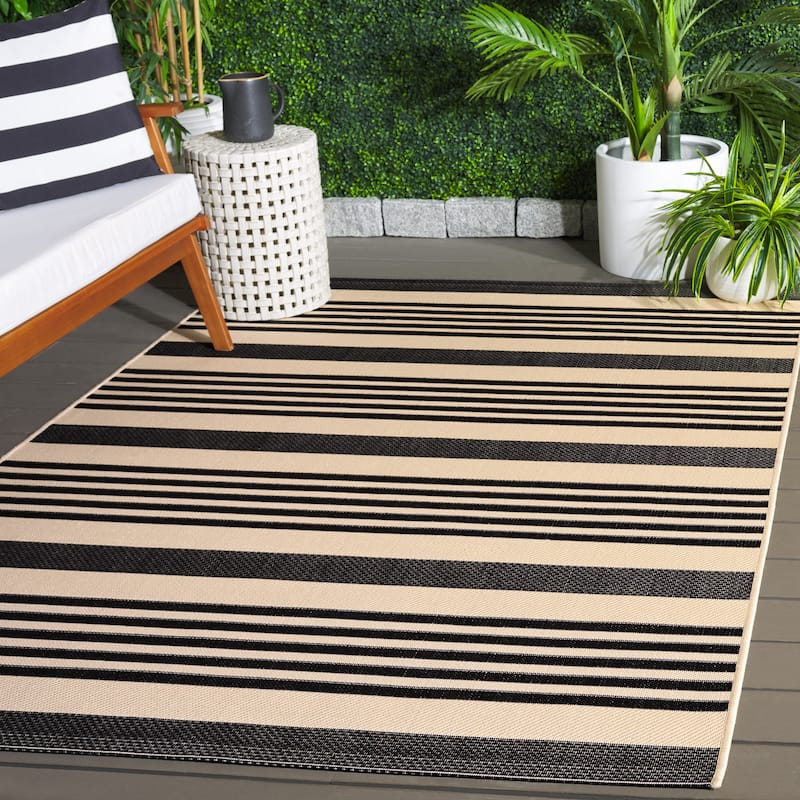 SAFAVIEH Courtyard Orsi Indoor/ Outdoor Waterproof Area Rug - 6'7" x 9'6" - Black/Bone