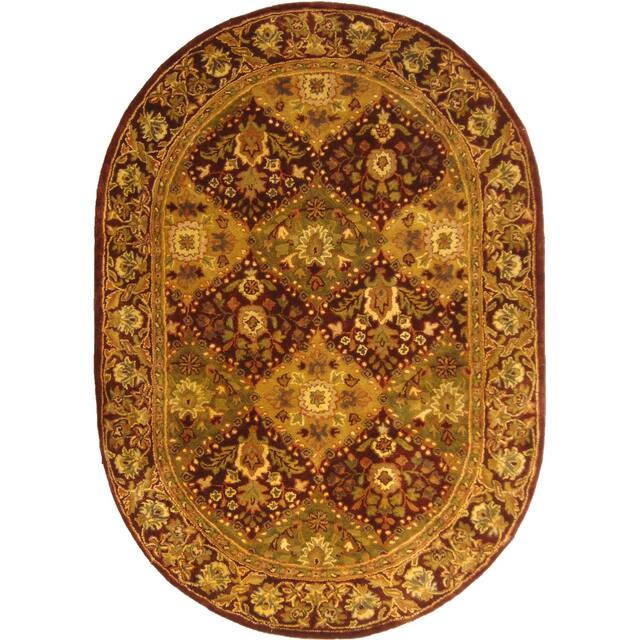 SAFAVIEH Handmade Antiquity Philomena Traditional Oriental Wool Rug - 7'6" x 9'6" Oval - Wine