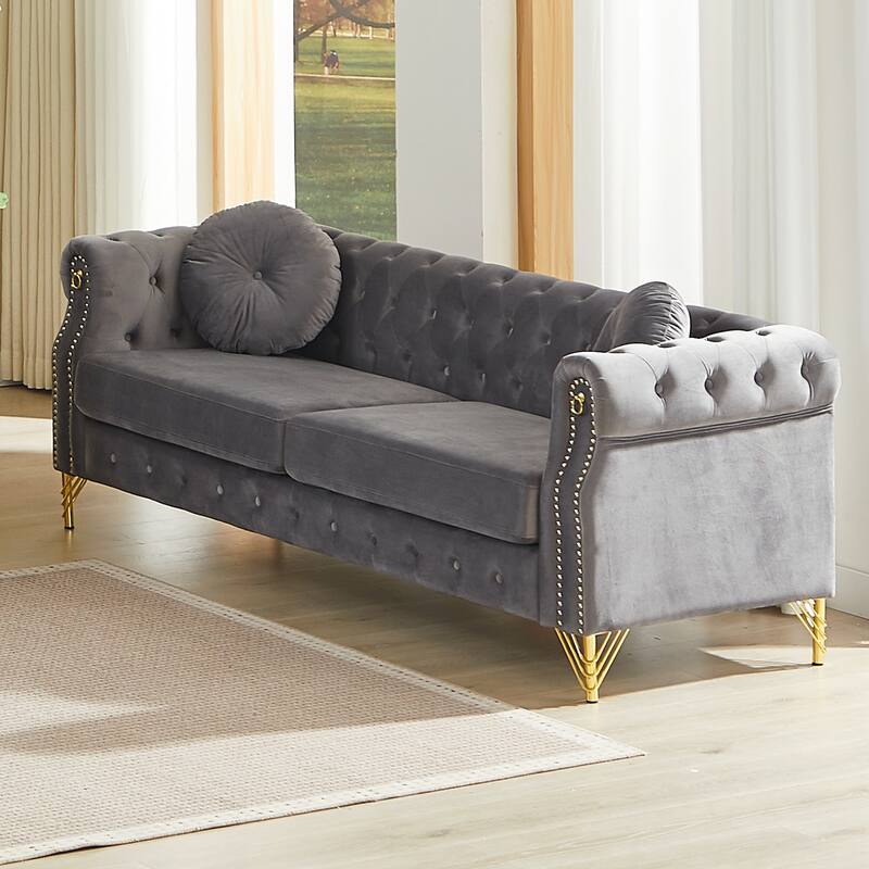 Chesterfield Sofa with Two Round Pillows, Featuring Copper Stud Detailing and Tufted Button Accents