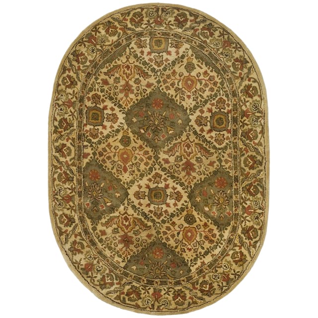 SAFAVIEH Handmade Antiquity Philomena Traditional Oriental Wool Rug - 7'6" x 9'6" Oval - Beige
