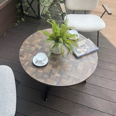 Round Coffee Table with Wood Grain and Black Metal, a Stylish and Functional Centerpiece for Your Living Space.