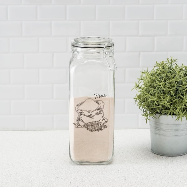 https://ak1.ostkcdn.com/images/products/is/images/direct/c2d0a859576ddb96542cca63218e55d0a1390c7d/Ludlow-67-oz.-Glass-Canister-with-Metal-Clasp%2C-Clear.jpg?impolicy=medium