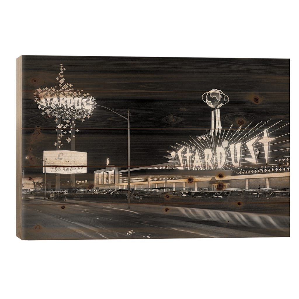 1960s Night Scene Of The Stardust Casino Las Vegas Nevada USA Print On Wood by Vintage Images - Multi-Color