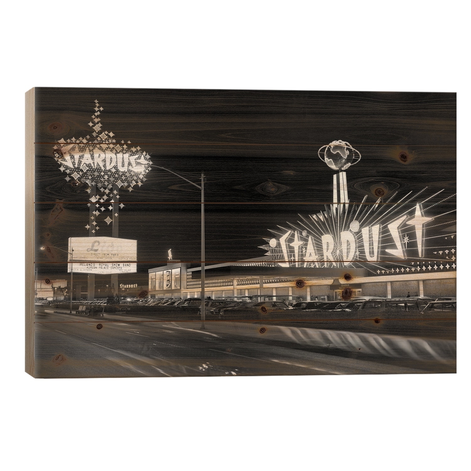 1960s Night Scene Of The Stardust Casino Las Vegas Nevada USA Print On Wood by Vintage Images - Multi-Color
