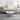 24 Inch Modern Coffee Table, Round Off White MDF Top, Tapered Brown Mango Wood Legs