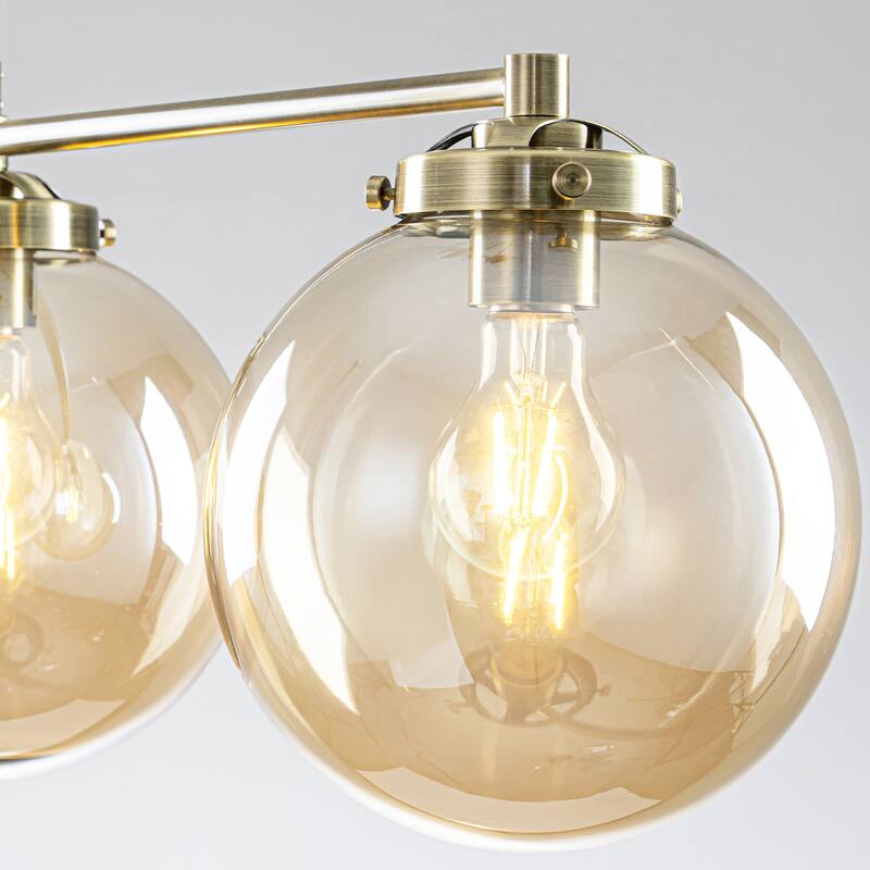 3-Light 33.46" Modern Gold & Antique Bronze Amber Glass Globe Linear Pendant - 33.46" W × 10.24" H × 7.87" D