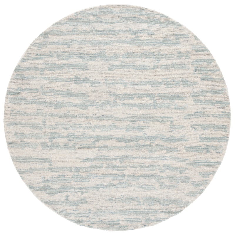 SAFAVIEH Handmade Ebony Anastasiya Modern & Contemporary Wool Rug - 6' Round - Ivory/Light Blue