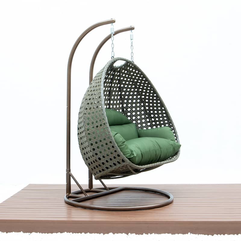 LeisureMod 2-Person Hanging Egg Swing Chair with Metal Stand - Handcrafted Beige Wicker, Patio Hammock Lounger with Cushions
