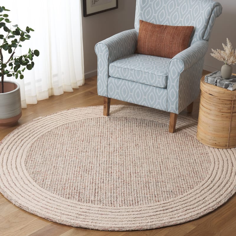 SAFAVIEH Handmade Ebony Dorith Border Wool Rug - 6' Round - Ivory/Red