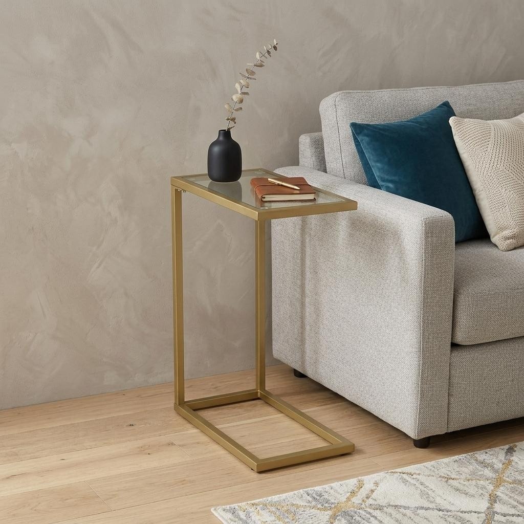 HomeRoots 26" Clear and Gold Glass and Steel Frame End Table - 10.00 in. x 25.50 in. x 16.00 in.