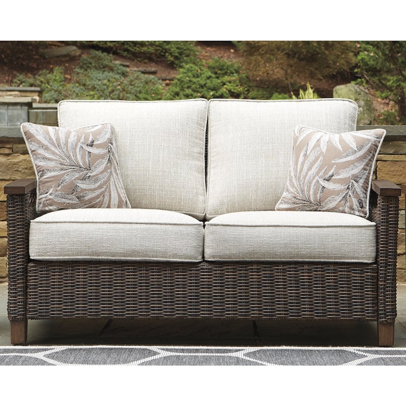 Signature Design by Ashley Paradise Trail Medium Brown/Beige Outdoor Loveseat, Lounge Chairs and Fire Pit Table