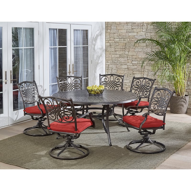 Hanover Traditions 7-Piece Dining Set in Red with a 60 In. Round Cast-top Table and Six Swivel Rockers