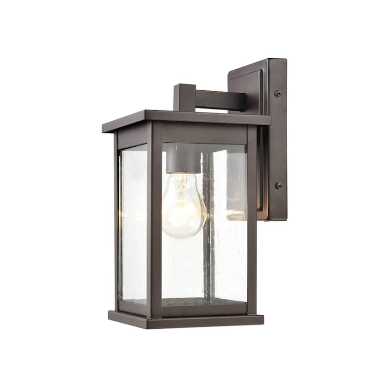 Millennium Lighting Bowton 1 Light Outdoor Wall Sconce in Powder Coat Bronze with a Clear Glass Shade