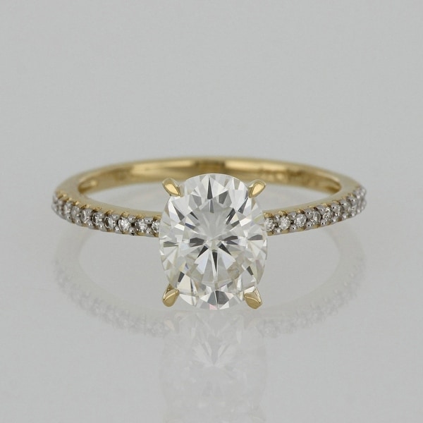 Miadora 2ct DEW Oval-cut Moissanite and 1/10ct TDW Diamond Engagement Ring in 14k Yellow Gold. Opens flyout.