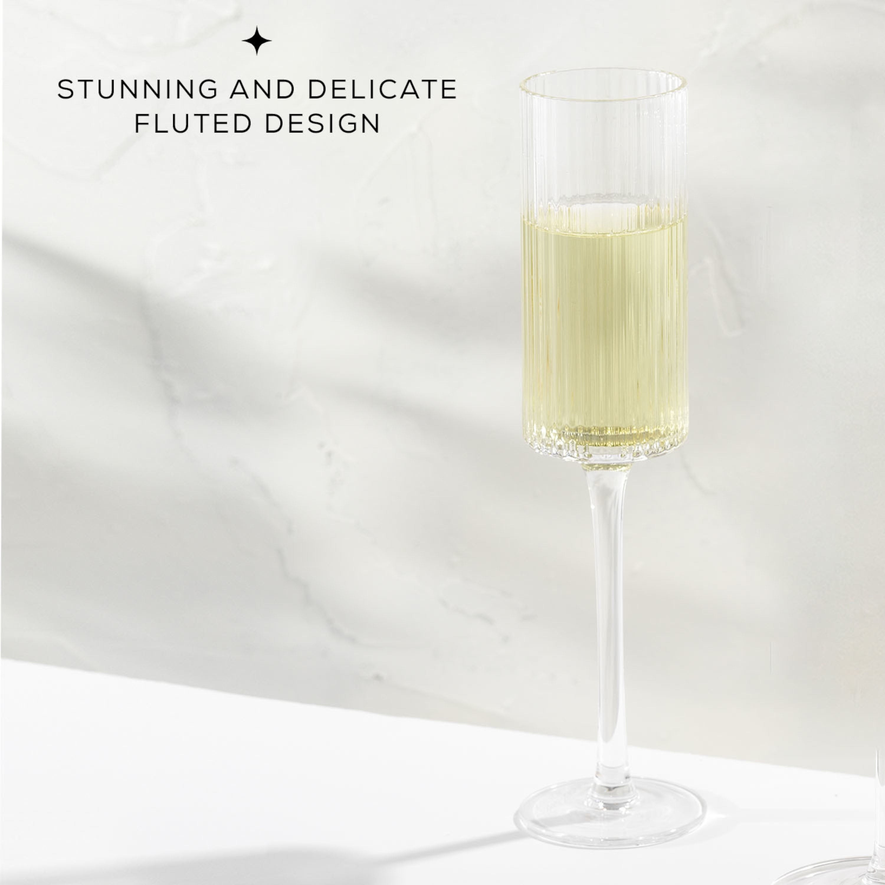 https://ak1.ostkcdn.com/images/products/is/images/direct/c618ab72c0e1afceda90271755d99a357344423e/JoyJolt-Elle-Fluted-Cylinder-Champagne-Glass---6-oz---Set-of-2.jpg