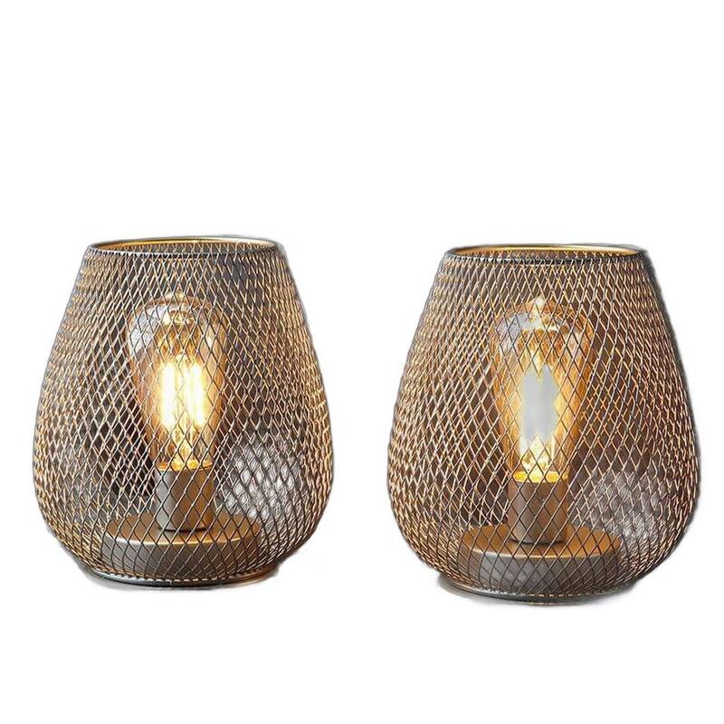 HomeRoots Set of Two 7" Silver And Gold Pierced Geometric Cordless Lantern Lamps - 5.60 in. x 6.70 in. x 5.60 in.