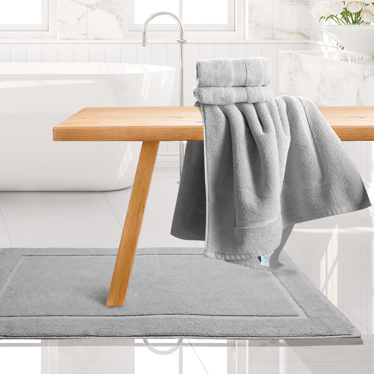 Washing bath mats with towels sales