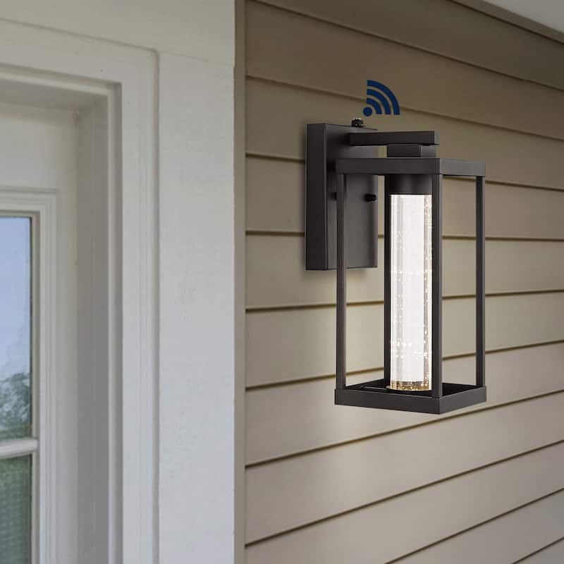 Justina 4.75" 1-Light Industrial Iron/Seeded Glass with Dusk-to-Dawn Sensor Integrated LED Outdoor Sconce, Black by JONATHAN Y