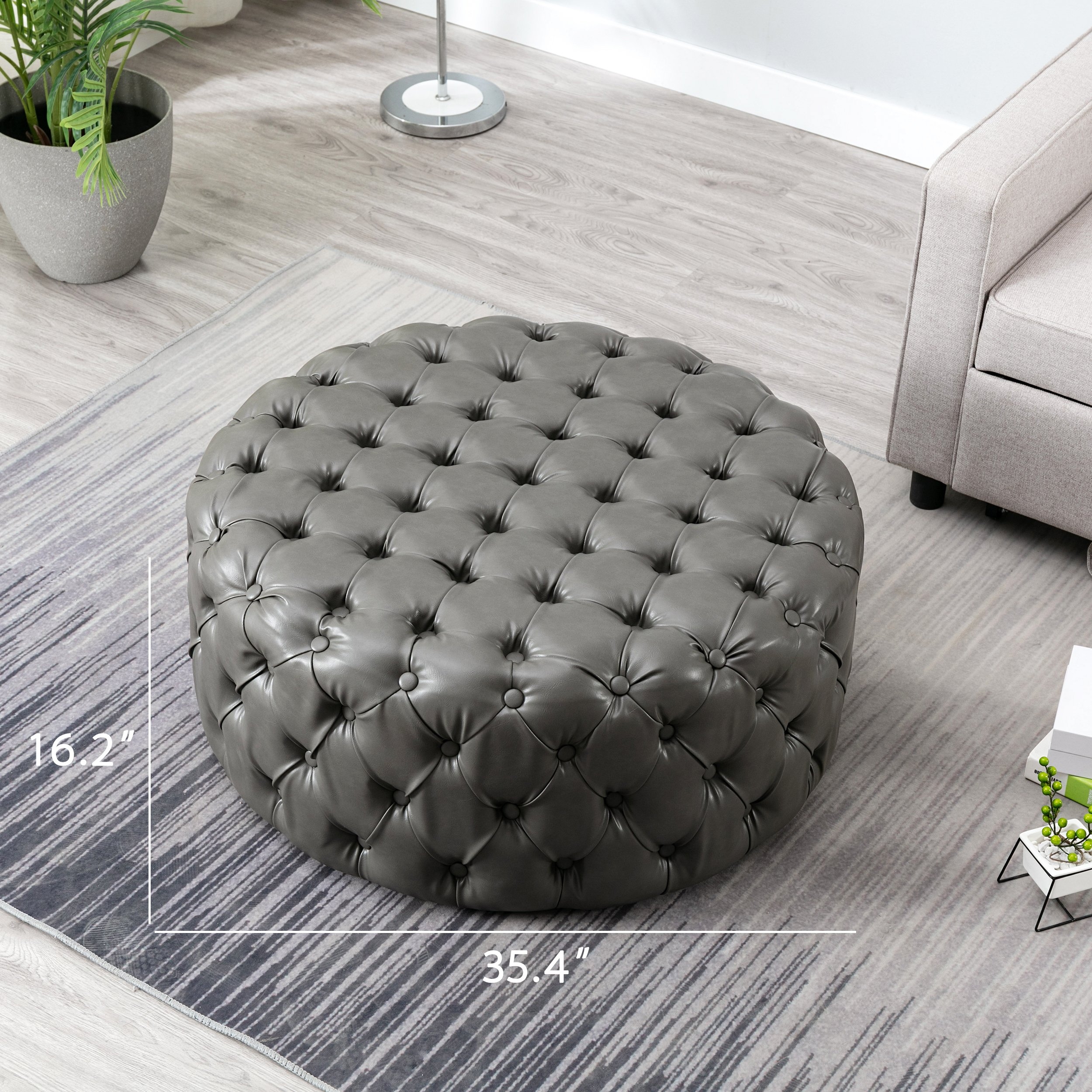 Round grey online leather ottoman