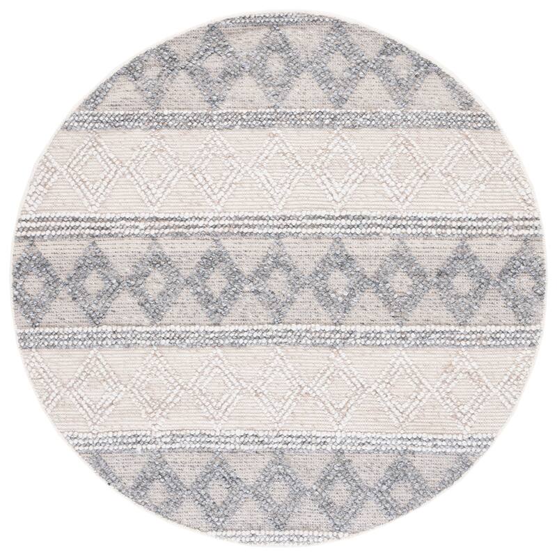 SAFAVIEH Handmade Natura Gerdje Wool Braided Tassel Rug