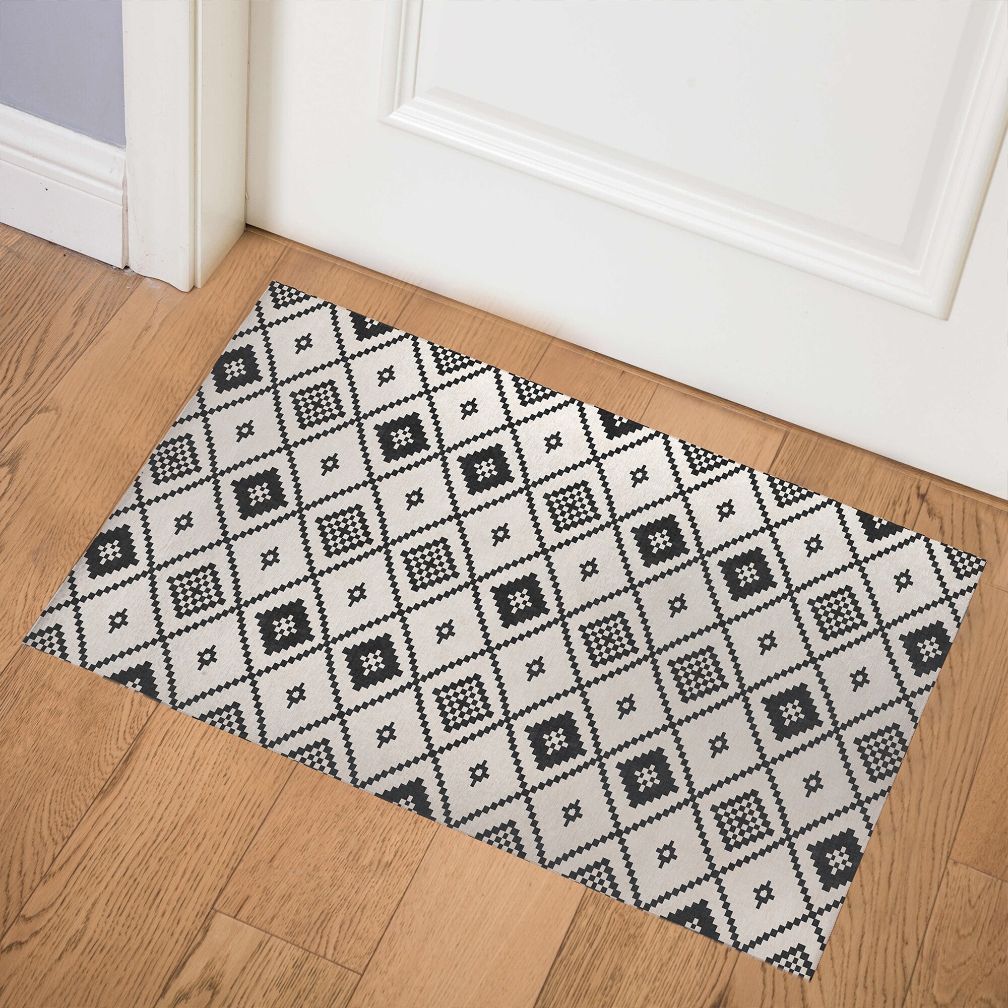 https://ak1.ostkcdn.com/images/products/is/images/direct/c73b661928840d374b0be57cea30b4cc0fa6a62a/SALAH-IN-BLACK-AND-TAN-Indoor-Floor-Mat-By-Becky-Bailey.jpg