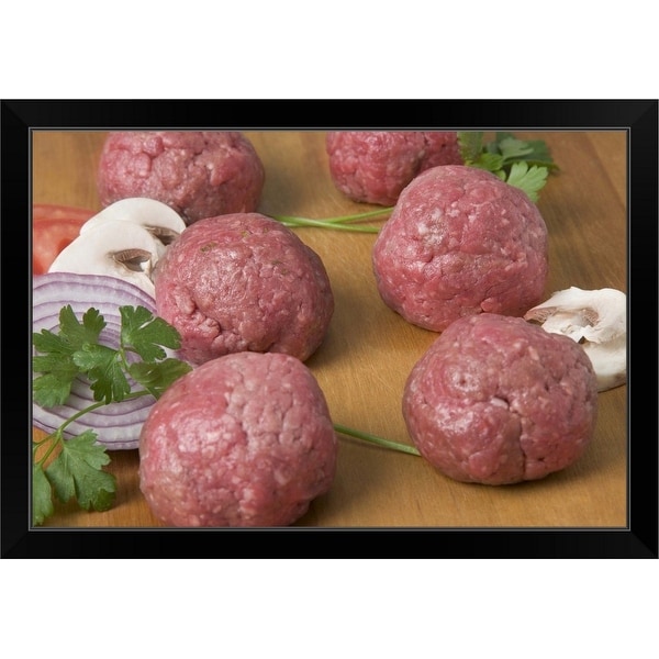"Raw meatballs on a cutting board" Black Framed Print