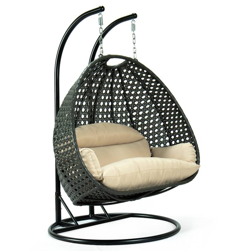 LeisureMod 2-Person Hanging Egg Swing Chair with Metal Stand - Handcrafted Charcoal Wicker, Patio Hammock Lounger with Cushions - Beige