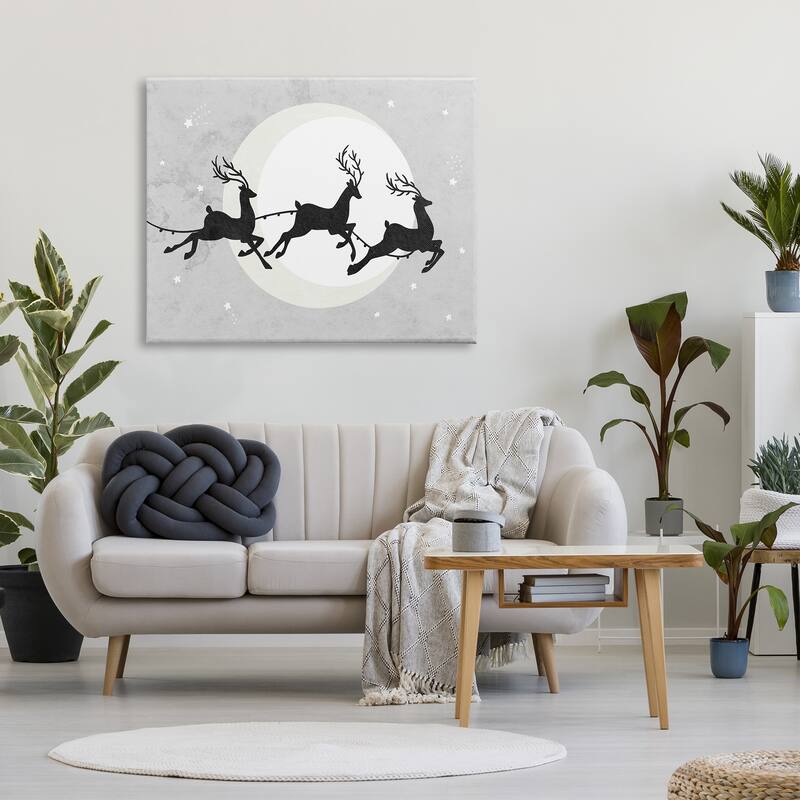 Stupell Reindeers Prancing Sleigh Line over Christmas Moon Canvas Wall Art - Grey