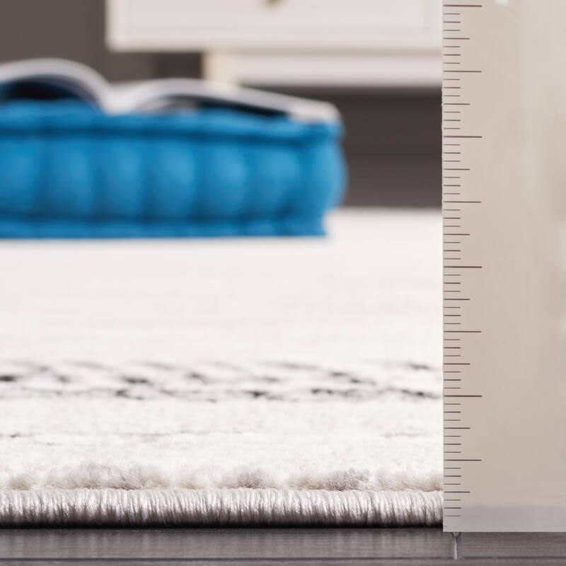 SAFAVIEH Skyler Otelia Modern Abstract Border Rug